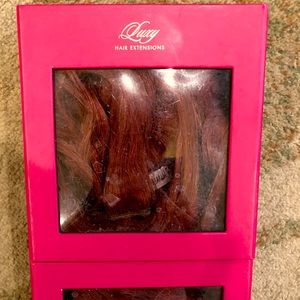 “Luxy hair extensions” clip in, layered set in a vibrant auburn red